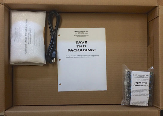 Divider installed showing accessories and 'save this packaging' notice