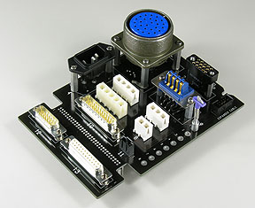 Custom plug-in board with a mix of circular, power, and Dsub connectors.